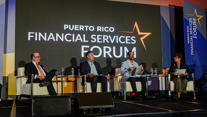 Panel discussion on stage at the 2023 Forum