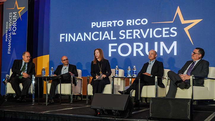 Panel discussion on stage at the 2023 Forum